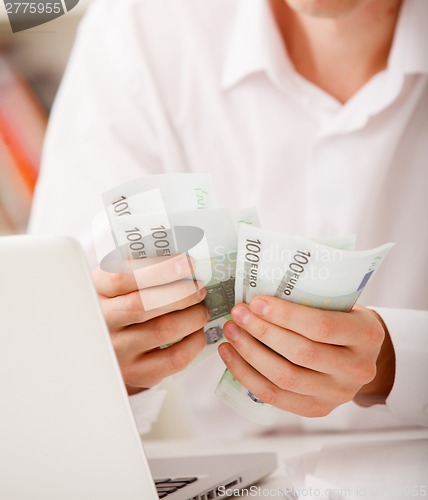 Image of hands with money