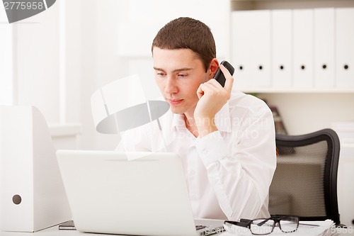 Image of man working and using laptop