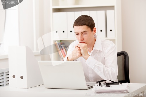 Image of man working on laptop