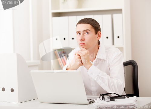 Image of man working on laptop