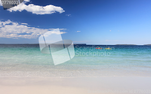 Image of Kayakers enjoy the crystal clear waters Australian Beach