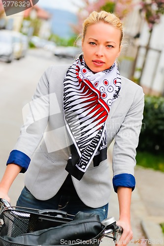 Image of Woman riding bicycle.