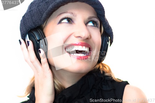 Image of Blonde lady listening to the music.