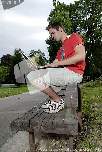 Image of Young man with notebook