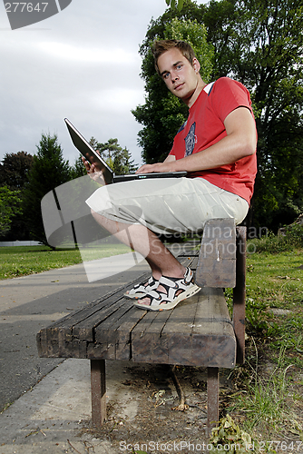 Image of Young man with notebook