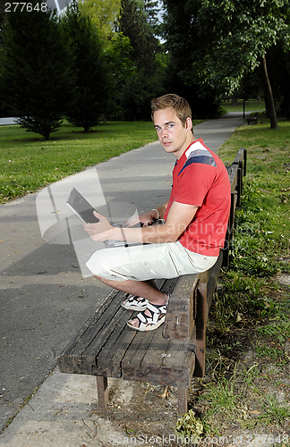 Image of Young man with notebook