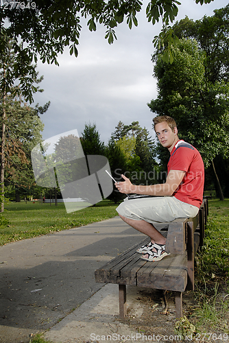 Image of Young man with notebook