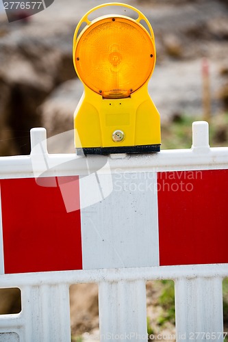 Image of yellow signal lamp on construction site