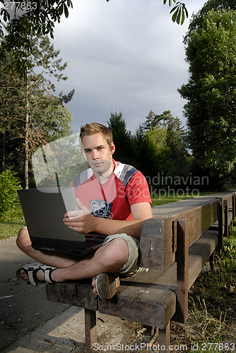 Image of Young man with notebook