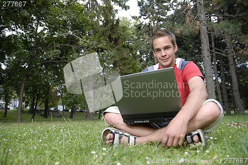 Image of Young man with notebook