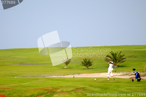 Image of Man playing golf
