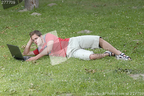 Image of Young man with notebook