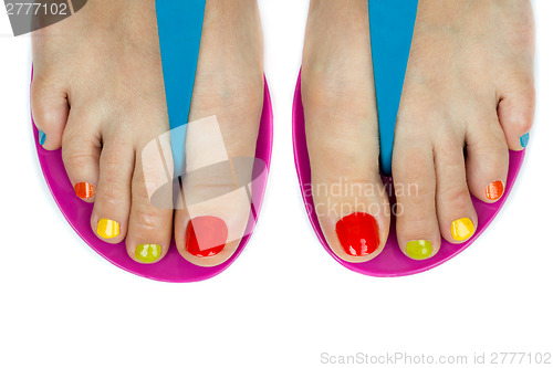 Image of Beautiful female feet with a pedicure color