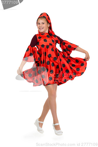 Image of Girl dancing in a red polka-dot dress 