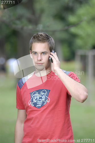 Image of Young man talking on phone