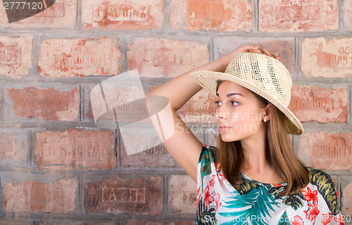 Image of Portrait of a girl in a straw hat