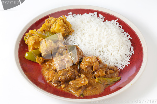 Image of chettinadu chicken curry with veg and rice