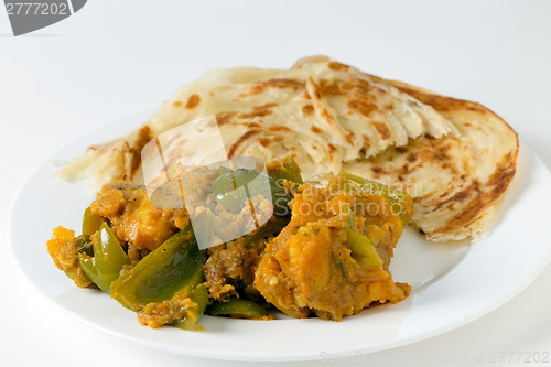 Image of Aloo capsicum curry and paratha side view