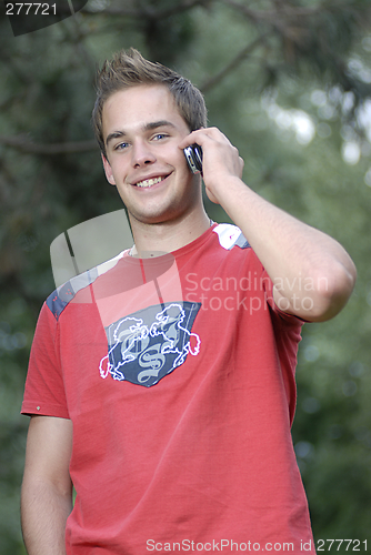 Image of Young man talking on phone