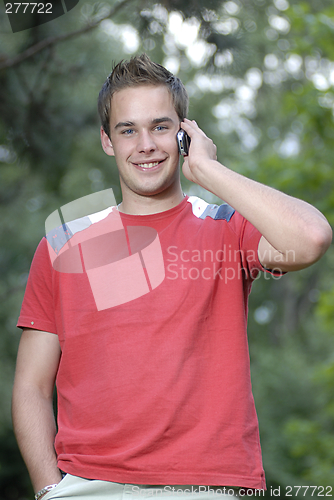 Image of Young man talking on phone