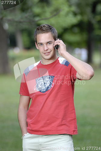 Image of Young man talking on phone