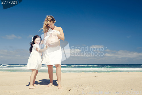 Image of Making a smile on mom's belly