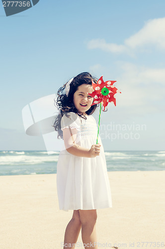 Image of Little girl with a windmill