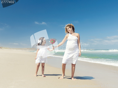 Image of Mother and daughter holding a windmill