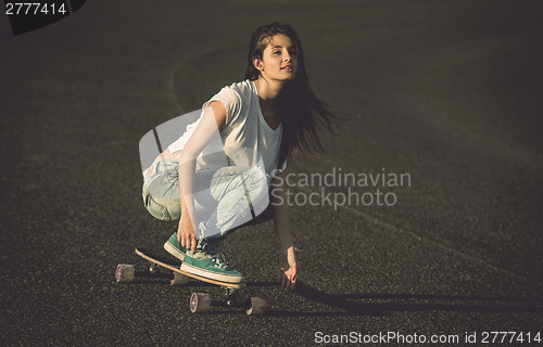 Image of Skater girl making dowhill