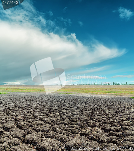 Image of global warming. dramatic sky over cracked earth