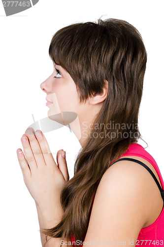 Image of young beautiful girl praying. isolated