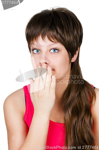 Image of young beautiful woman covering her mouth with her hand. isolated
