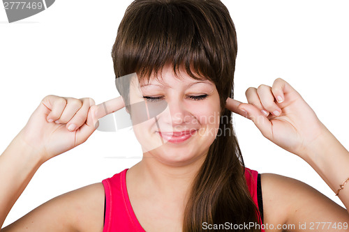 Image of young beautiful woman covering her ears. isolated
