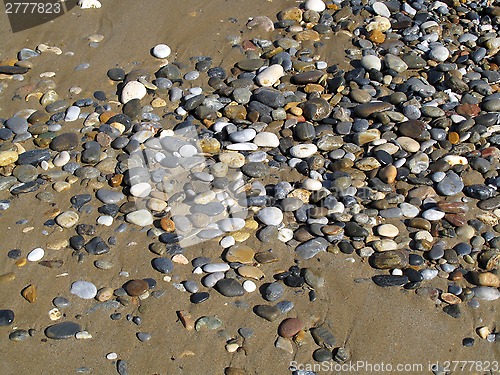 Image of Sand with sea pebbles