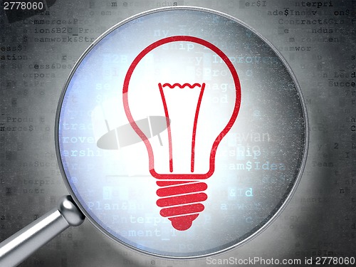 Image of Finance concept: Light Bulb with optical glass on digital background