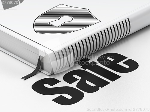 Image of Privacy concept: book Shield With Keyhole, Safe on white background