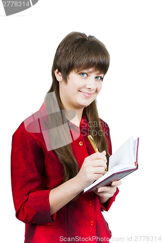 Image of Beautiful young girl with notebook and pen on a white