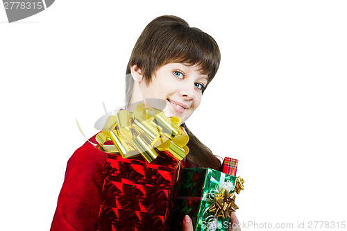 Image of Beautiful young girl with a bunch of gift boxes on white