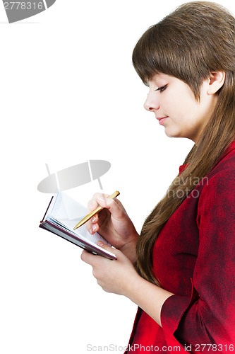 Image of Beautiful young girl with notebook and pen on a white
