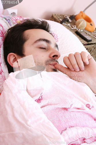 Image of Young man sleeping .