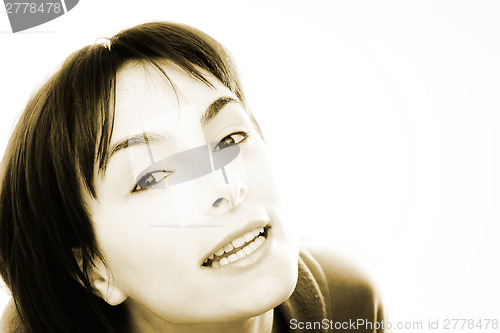 Image of Young woman in bed