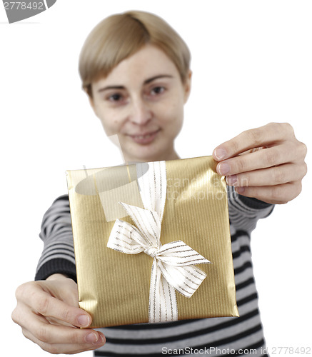 Image of Young woman holding a present