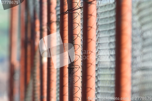 Image of perspective view of rusty metal fence