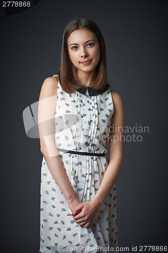 Image of Portrait of smiling teen female in romantic dress