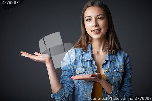 Image of Portrait of denim teen female welcoming