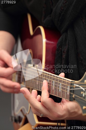 Image of Playing the guitar