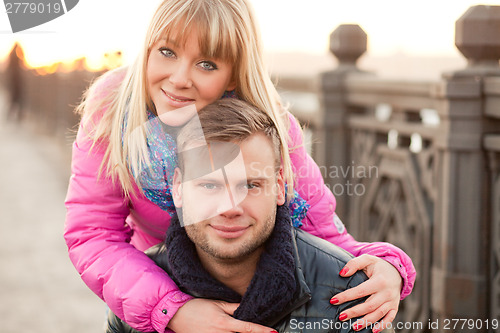 Image of Woman is hugging her boyfriend in winter