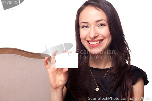 Image of Smiling young woman holding blank businesscard