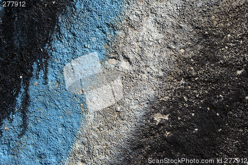 Image of Graffiti detail on a grainy concrete wall