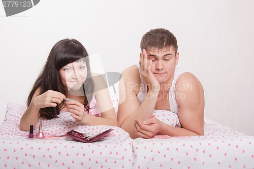 Image of Guy fell asleep while she was engaged in manicure